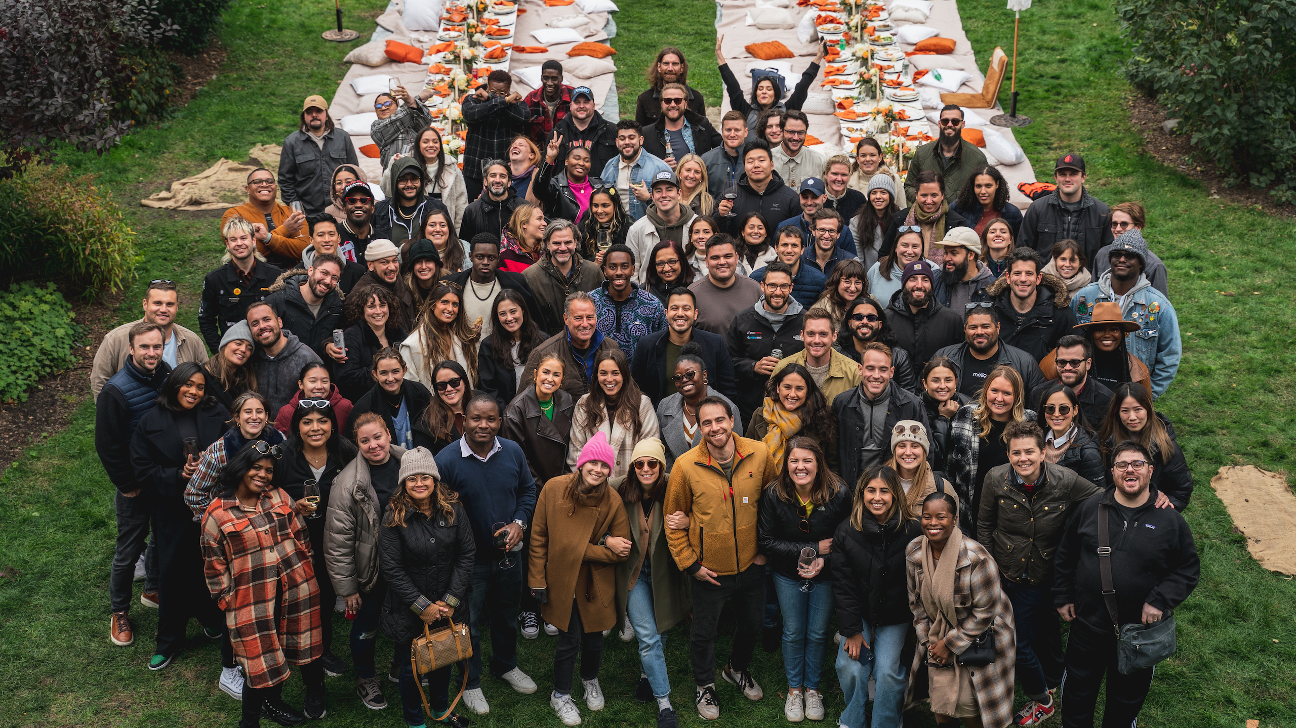 A group photo outdoors at the Melio company picnic. 