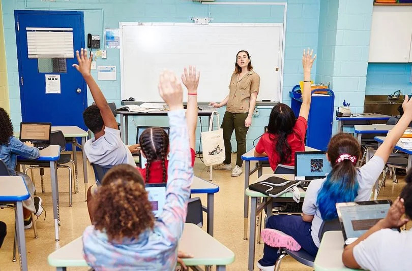 Teacher in a classroom teaching children