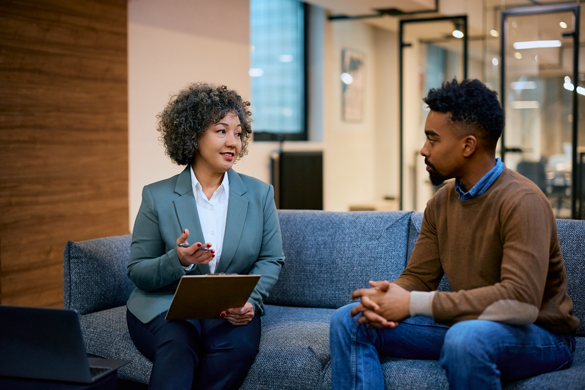 Financial advisor having a meeting with a client man in the office.