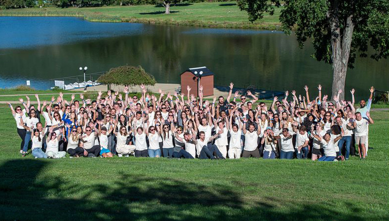 Eden Health team outside near a lake