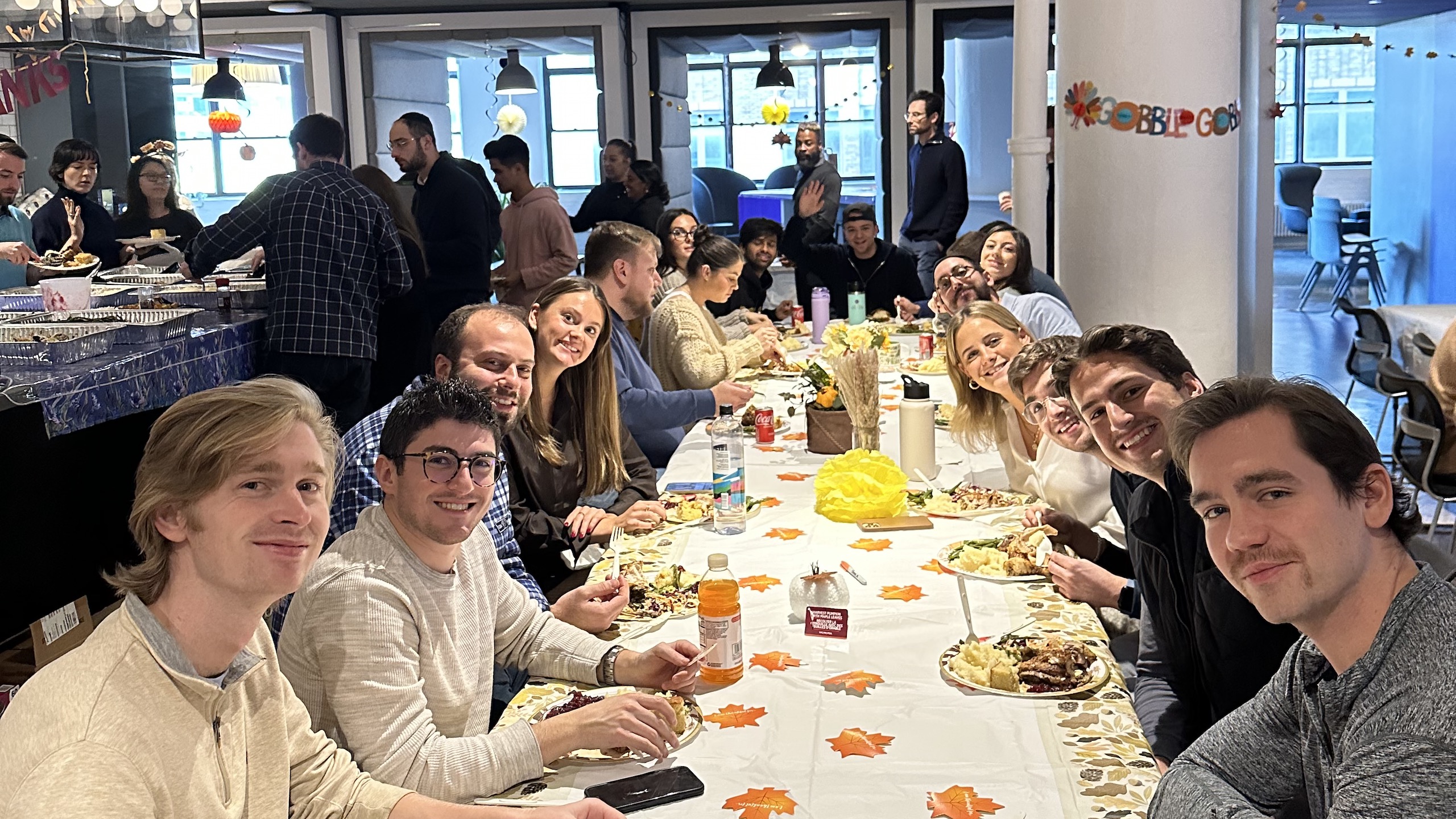 Lev team members gathered around a table at a company lunch.