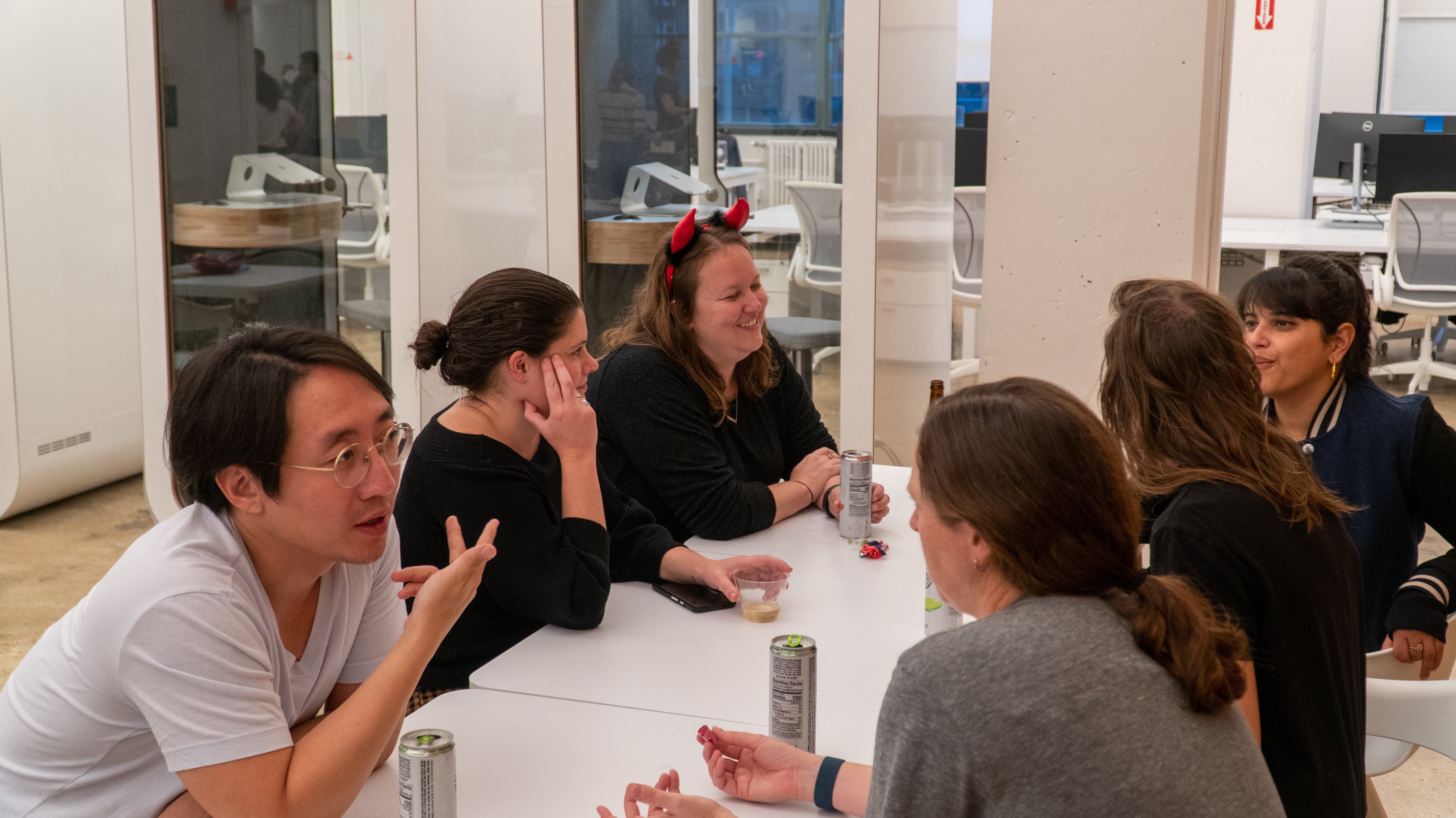 Jason Lee and other Maven Clinic team members in discussion in the office