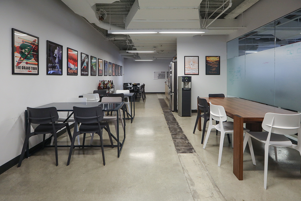 Kitchen area in the NS1 office with framed posters on the wall