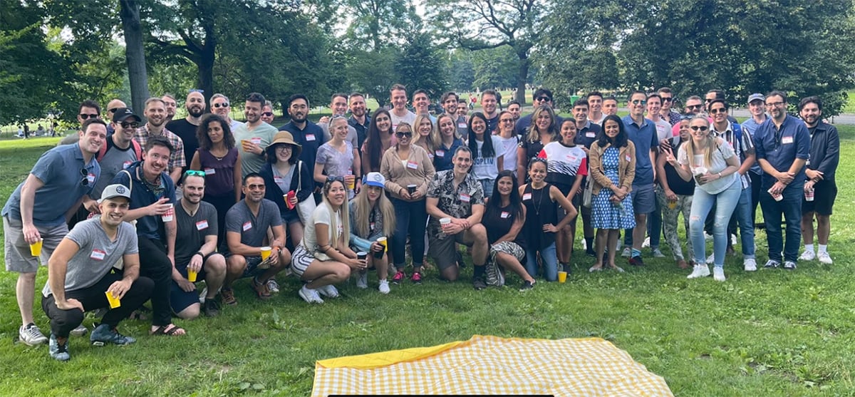 Sisense team hanging out together at a park