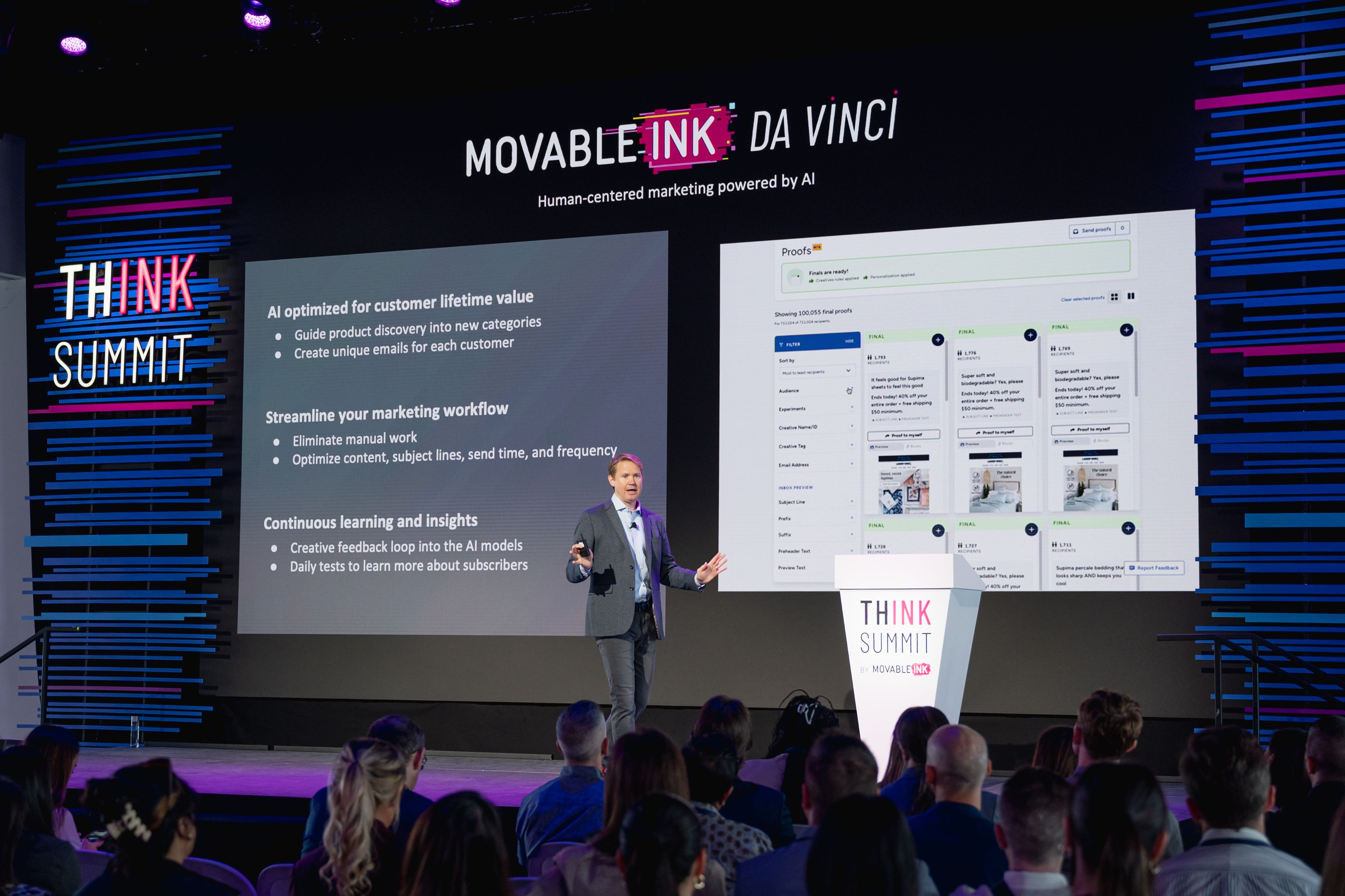 Chief Product Office Bryan Wade stands on stage presenting Movable Ink's AI-powered product.