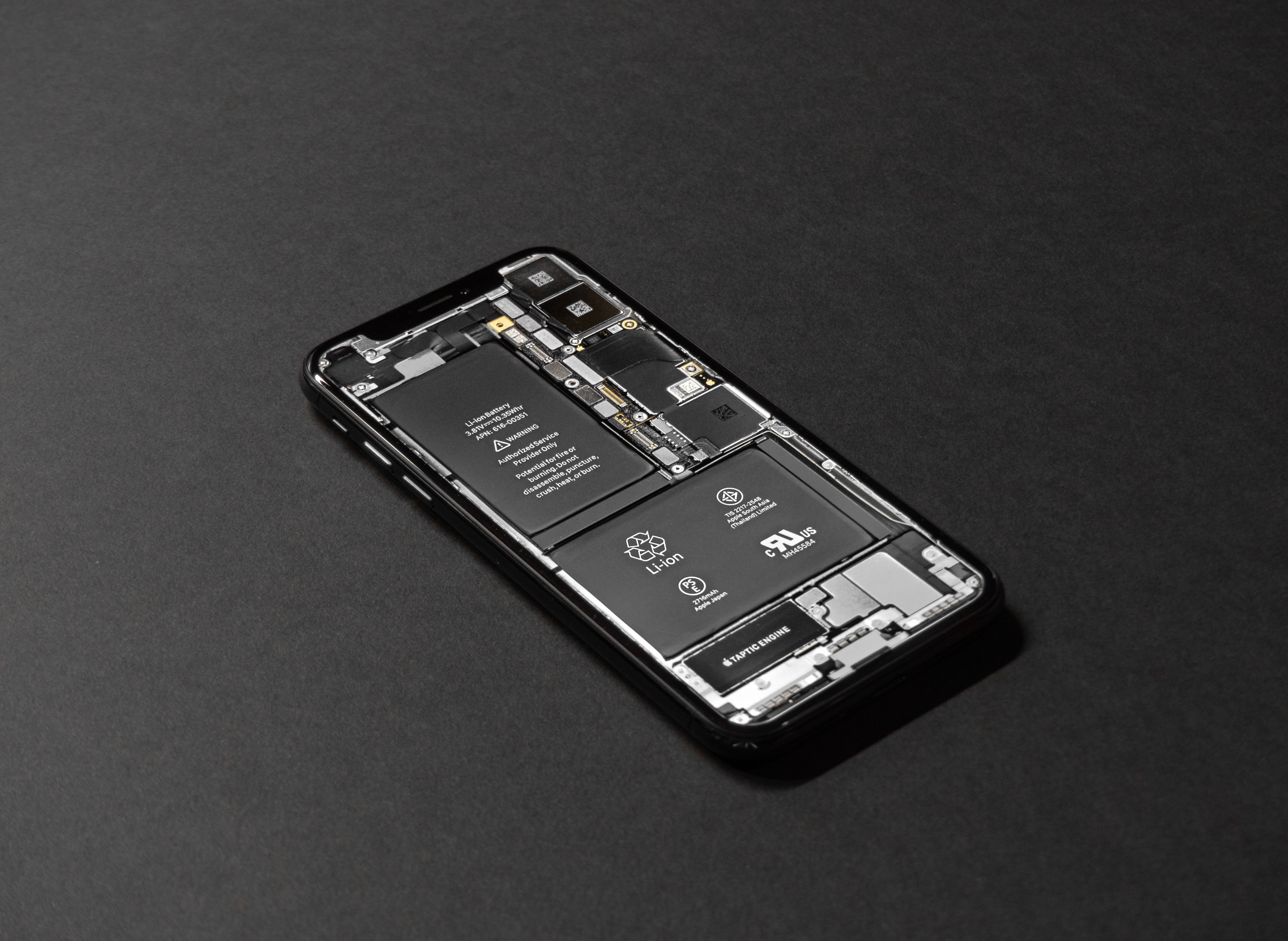 A phone with the back removed and internals exposed